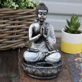 Estatuilla de Buda en Postura de Oración con Velas