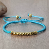 Pulsera Budista Trenzada a Mano con Piedra Turquesa