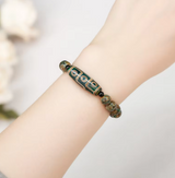 Pulsera Dzi de 9 Ojos Prosperidad