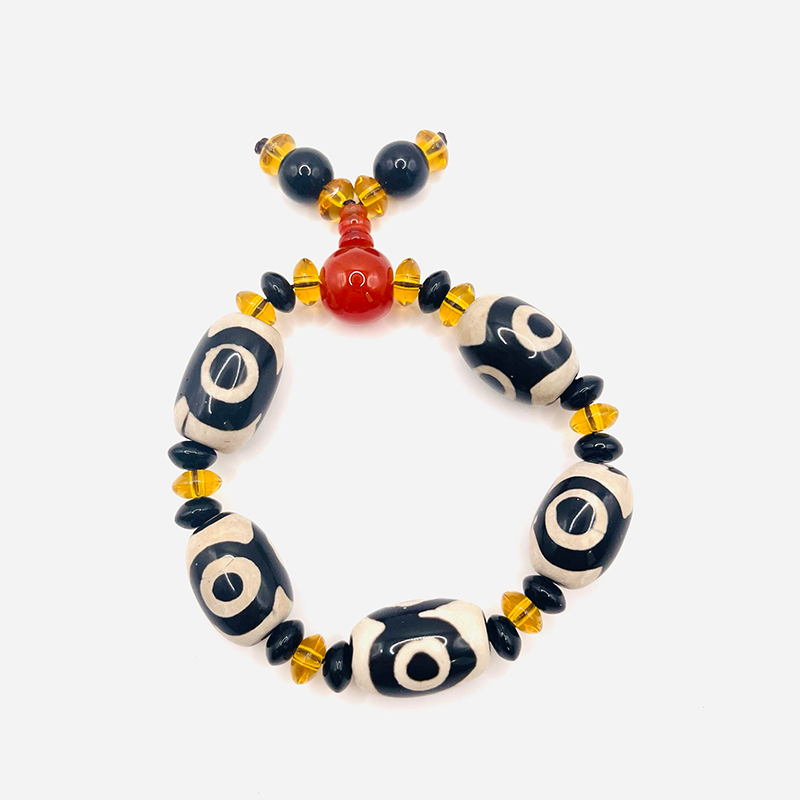 Pulsera Dzi de 3 Ojos – Riqueza - negro y blanco